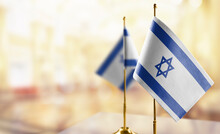 Small Flags Of The Israel On An Abstract Blurry Background