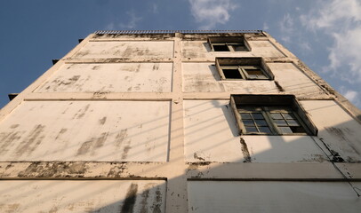 Abandoned building soars into blue sky