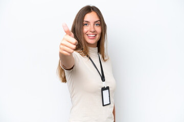 Wall Mural - Young pretty woman with ID card isolated on white background with thumbs up because something good has happened