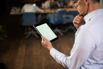 Close up of man using digital tablet