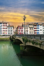 Bayonne In The Pays Basque, Typical Facades And Bridge On The River Nive
