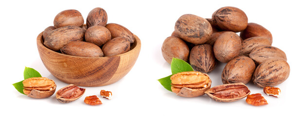 Wall Mural - pecan in a wooden bowl with leaves isolated on white background