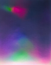 Abstract Pastel Iridescent Holographic Plastic Foil Background With Light Leaks. Holo Color Material. Cool Glitter Surface With Shiny Rainbow Feel.