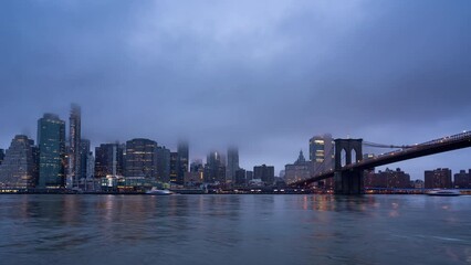 Wall Mural - Timelapse of Manhattan skyline and Brooklin bridge at dusk, night to day transition, New York city