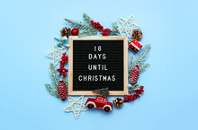 Felt Letterboard With Countdown Surrounded By Winter Decoration On Blue Background. 16 Days Until Christmas. Twenty-four Day Series Of Postcards. Selective Focus