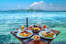 Breakfast On The Beach By The Pool With A Look Over The Ocean Of La Digue Seychelles,tropical Island