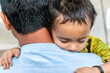 © Ali Magsi - Asian refugee with his sick child at a border