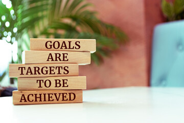 Poster - Wooden blocks with words 'GOALS ARE TARGETS TO BE ACHIEVED'.