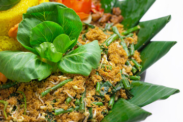 selective focus Urap is Indonesia Traditional Food. Urap is a salad dish of steamed vegetables mixed with seasoned and spiced grated coconut for dressing