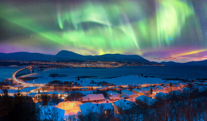 Wall Mural - aurora borealis or northern lights in the sky over tromso with sandnessundet bridge - tromso, norway