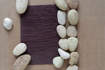 Wall Mural - textured brown paper frame with stones