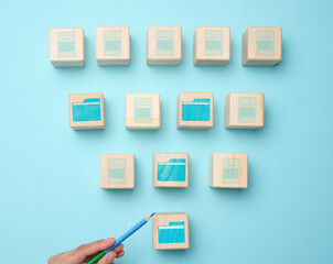 Cubes with folder icons on a blue background. Data systematization concept