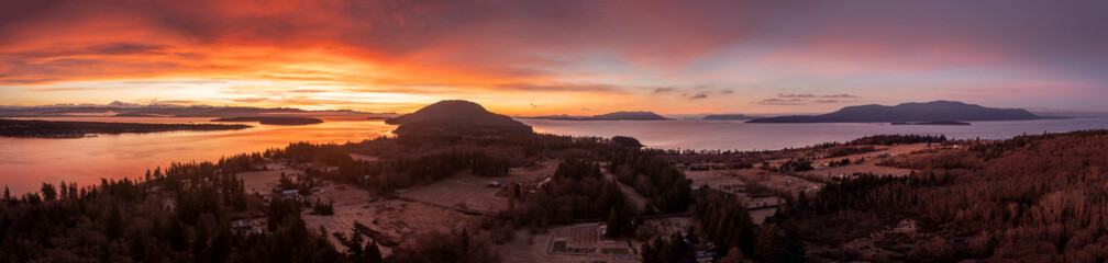 Wall Mural - Aerial Winter Sunrise Over Hale Passage and Lummi Island. Snow blankets this lovely small island located minutes from Bellingham, Washington and accessed by a twenty one car ferry boat. 