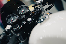 Horizontal Close-up Of The Speedometer And Tachometer Of A Vintage Black-toned Motorcycle