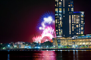 Wall Mural - Sydney Harbour Bridge New Years Eve fireworks, colourful NYE fire works lighting the night skies with vivid multi colours NSW Australia. Happy New Year. New Year Eve