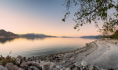 Wall Mural - Panoramic view of Egirdir lake coast in Isparta region. Calm turquoise and scenic coast of national park in Turkey