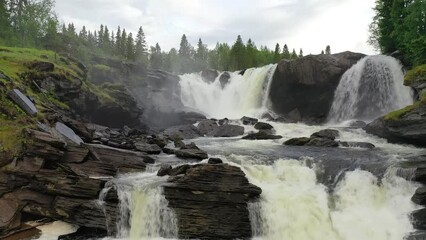 Wall Mural - Ristafallet waterfall in the western part of Jamtland is listed as one of the most beautiful waterfalls in Sweden. 