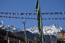 Panoramic Landscape View Of Tibetan Prayer Flags Raised In Lachen With Snowcapped Great Himalayas In The Background In North Sikkim, India