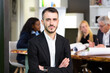 © Alessandro Grandini - Formal business male portrait. Confident successful caucasian businessman with arms crossed, looks directly at camera