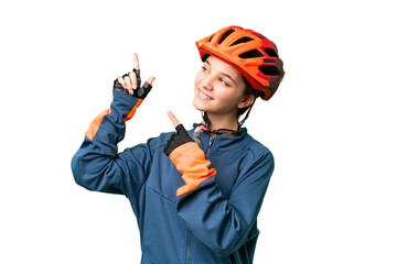 Wall Mural - Teenager cyclist girl over isolated chroma key background pointing with the index finger a great idea