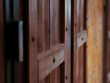 dark brown wooden shop door closed