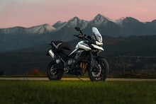 Triumph Tiger Motorcycle In Mountains