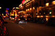 © New Africa - Blurred view of city street with lights at night. Bokeh effect