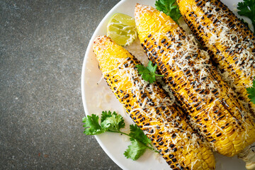 barbecue and grilled corn with cheese and lime