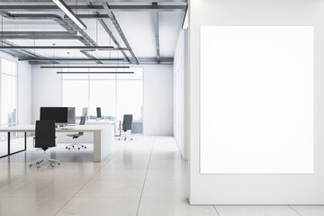 Poster - Front view on blank white poster on light wall background in spacious coworking office with monochrome interior design, light glossy floor, loft ceiling lamps and big window. 3D rendering, mock up