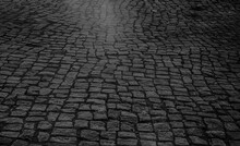 Paving Stone Vintage Road Cover. Evening Road In A Historical Place. Old Square Cobblestone Paving Perspective Background