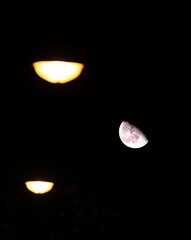 Wall Mural - abstract shot of defocused street lights and waning gibbous moon