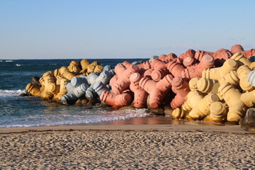 Colorful jetty stones on beach