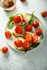 Canvas Print - Crostini with strawberry, cheese and honey