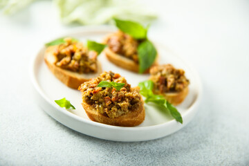 Canvas Print - Crostini with olive tapenade and basil