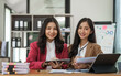 © Phushutter - Asian company employees and colleagues work together in the office. by talking and giving advice to each other