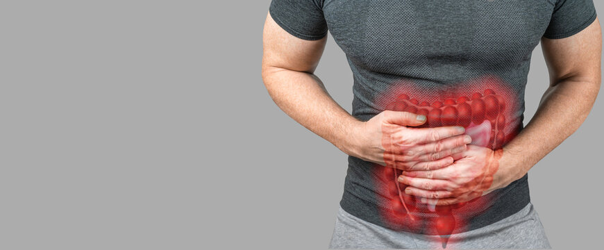 Wall Mural -  - Intestinal inflammation. Abdominal pain man, photo of large intestine on man body, stomachache diarrhea symptom or food poisoning. gray background, copy space