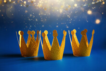 Happy Epiphany Day, Three Kings Day Greeting Card With Three Gold Crowns On Blue Background. Concept For Dia De Reyes Magos Day, Three Wise Men, Epiphany Christian Feast Day
