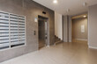 © gluschenkoart - mailboxes in the lobby of an apartment building