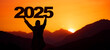 Landscape background banner panorama 2025 - Breathtaking view with black silhouette of mountains and man holding year, in the morning during the sunrise