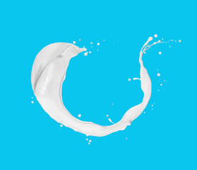 Wall Mural - Cream or milk splashes in the air close up on blue background