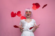 girl with pink hair in a dress screams and throws confetti on a pink background, a woman with hearts and valentines