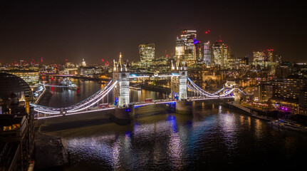 Wall Mural - London Tower Bridge and City of London by night - amazing aerial view - LONDON, UNITED KINGDOM - DECEMBER 20, 2022