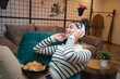 © Miljan Živković - one woman having homemade baked croissant for breakfast at home