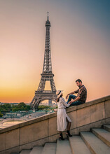 Couple Men And Woman Honeymoon On Paris Eiffel Tower France, Couple Men And Woman City Trip In Paris During Summer At Sunrise