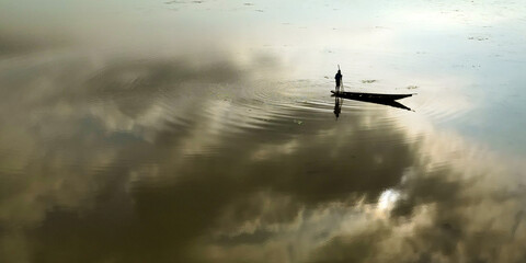 Wall Mural - aerial view of a fisherman in his boat on the mekong river	