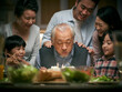 © imtmphoto - three generation asian family celebrating grandpa's birthday at home