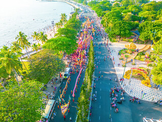 Wall Mural - Top view of dragon dance perform celebration new year. Group of people perform a traditional lion dance and dragon dance. Guinness record performance of 54 Dragons dance on the street Vung Tau.