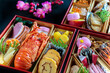 お節料理の重箱を俯瞰したクローズアップ。日本料理,季節料理,お祝いのイメージ