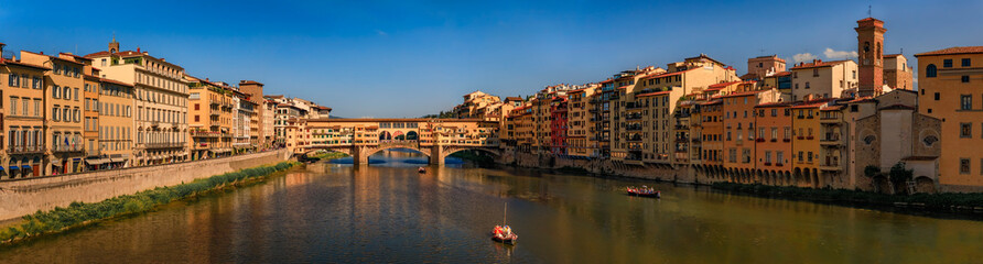 Wall Mural - Cityscape with the famous bridge of Ponte Vecchio on the river Arno River in Centro Storico, Florence, Italy