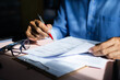 © Lek - Close-up view on desk office, businessman signing a contract of investment or insurance, legal agreement on the table, Starting successful partnership with entrepreneur or companie, making good deal